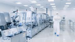 stock-photo-shot-of-sterile-pharmaceutical-manufacturing-laboratory-where-scientists-in-protective-coverall-s-1268263645
